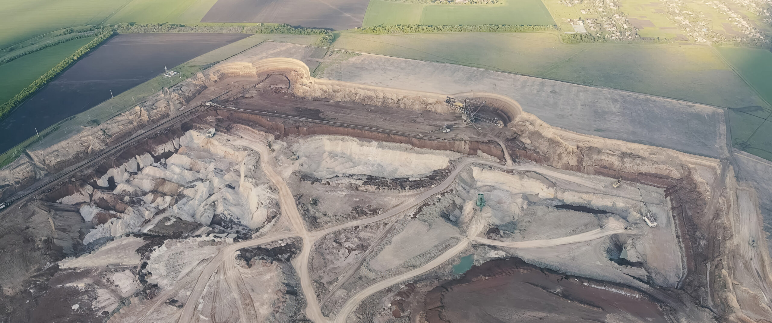 a top view of gold mine with machinery and vehicles.