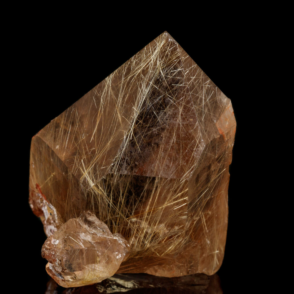macro stone mineral rutile in quartz on a black background