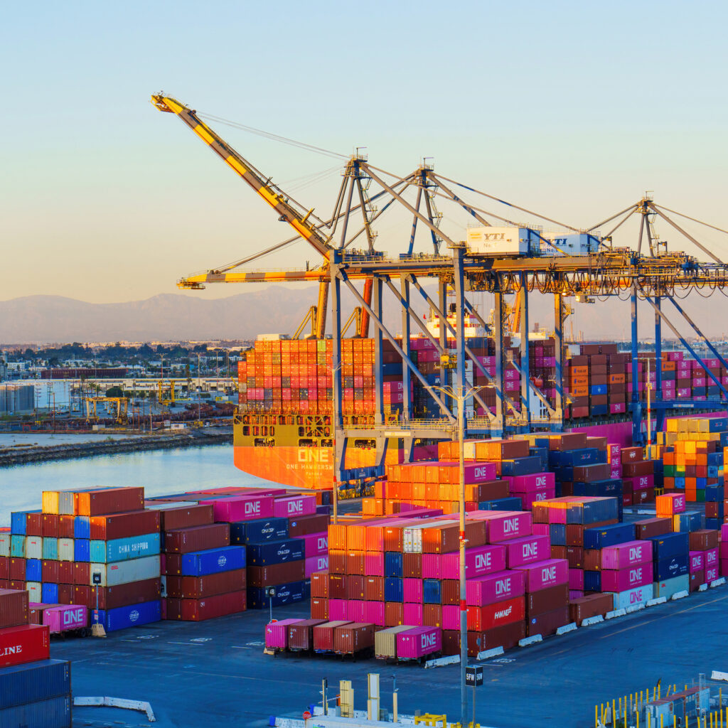 cranes loading containers at long beach port, ca